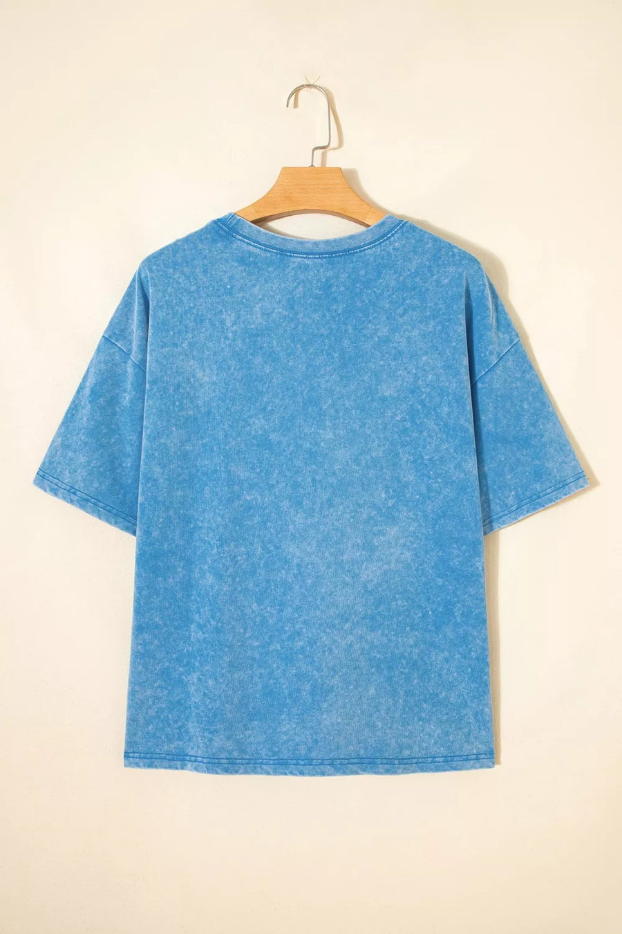 Blue acid wash cotton maternity t-shirt with short sleeves and crew neck.