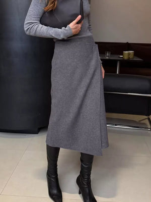 wrap skirt in slate gray featuring asymmetrical and A-line fit