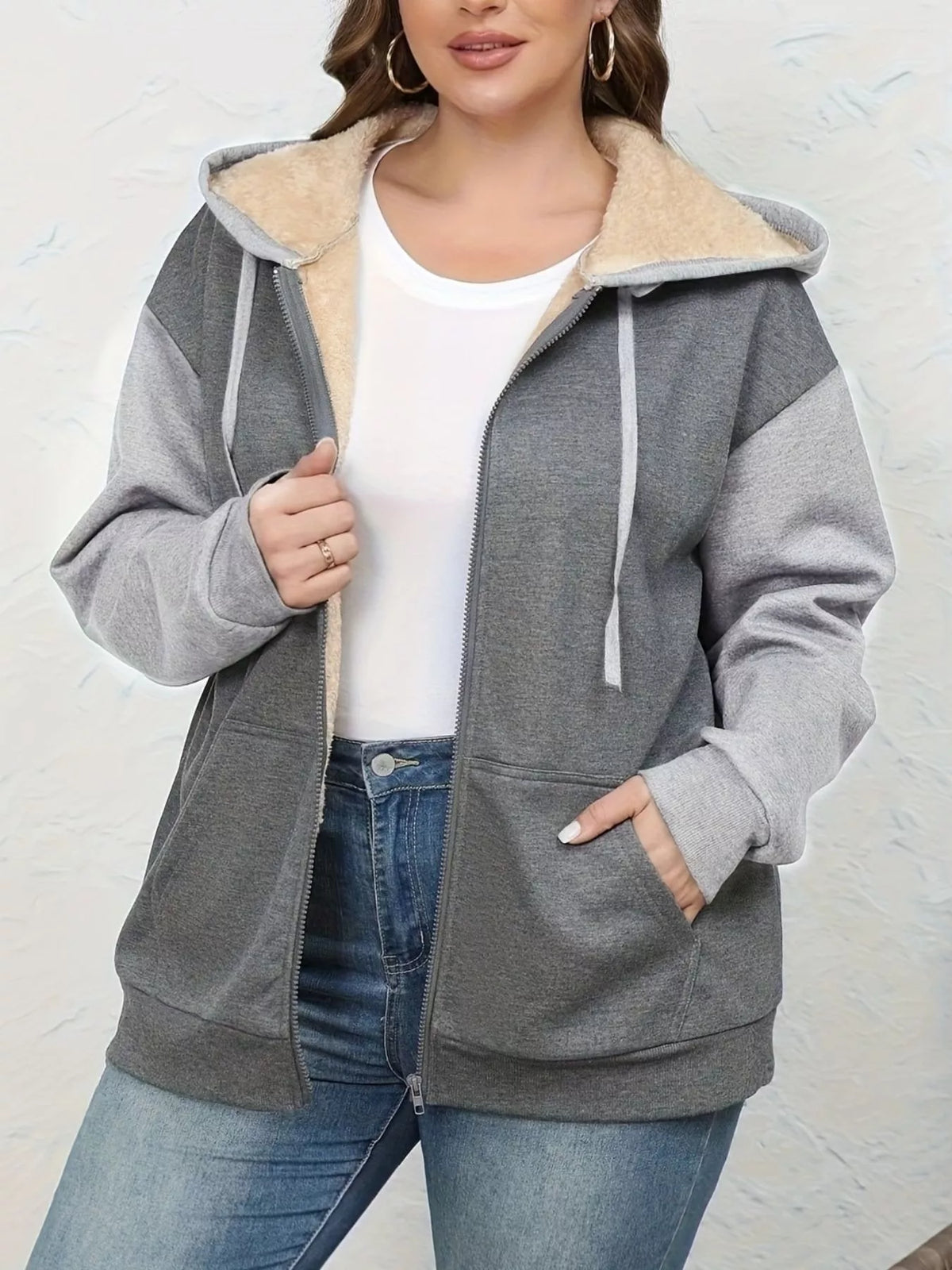 Gray sherpa lined zip-up hoodie with drawstring and pockets.