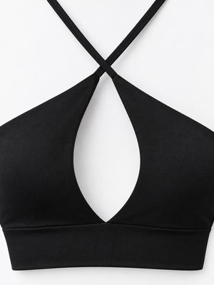 At least 95% polyester with spandex halter top in Fluorescent Orange with fitted silhouette