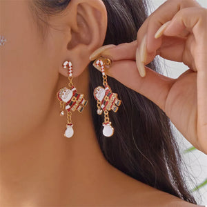 white earrings featuring rhinestone embellishment and Santa Claus motif