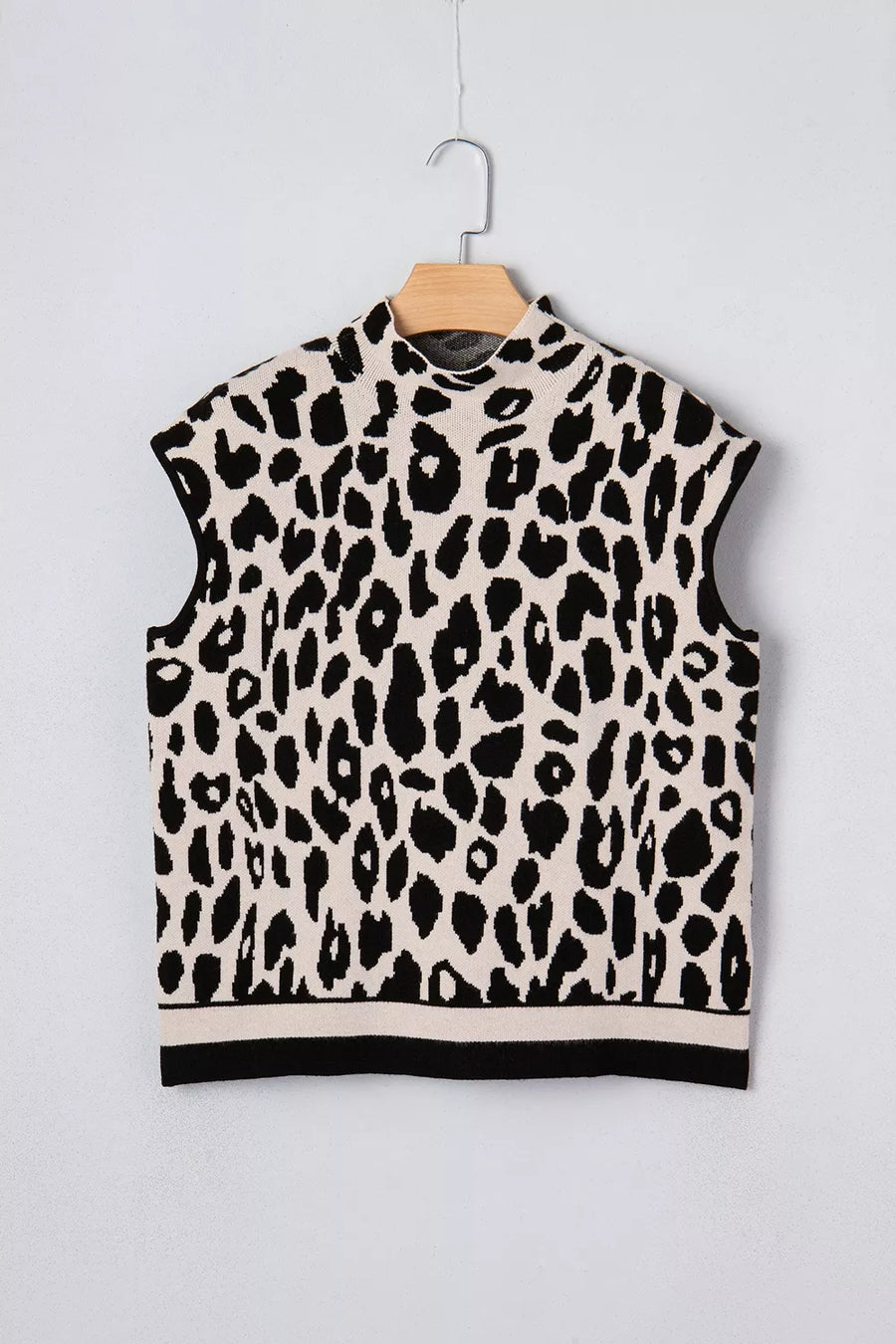 black mock neck sweater with ribbed hem and short sleeve