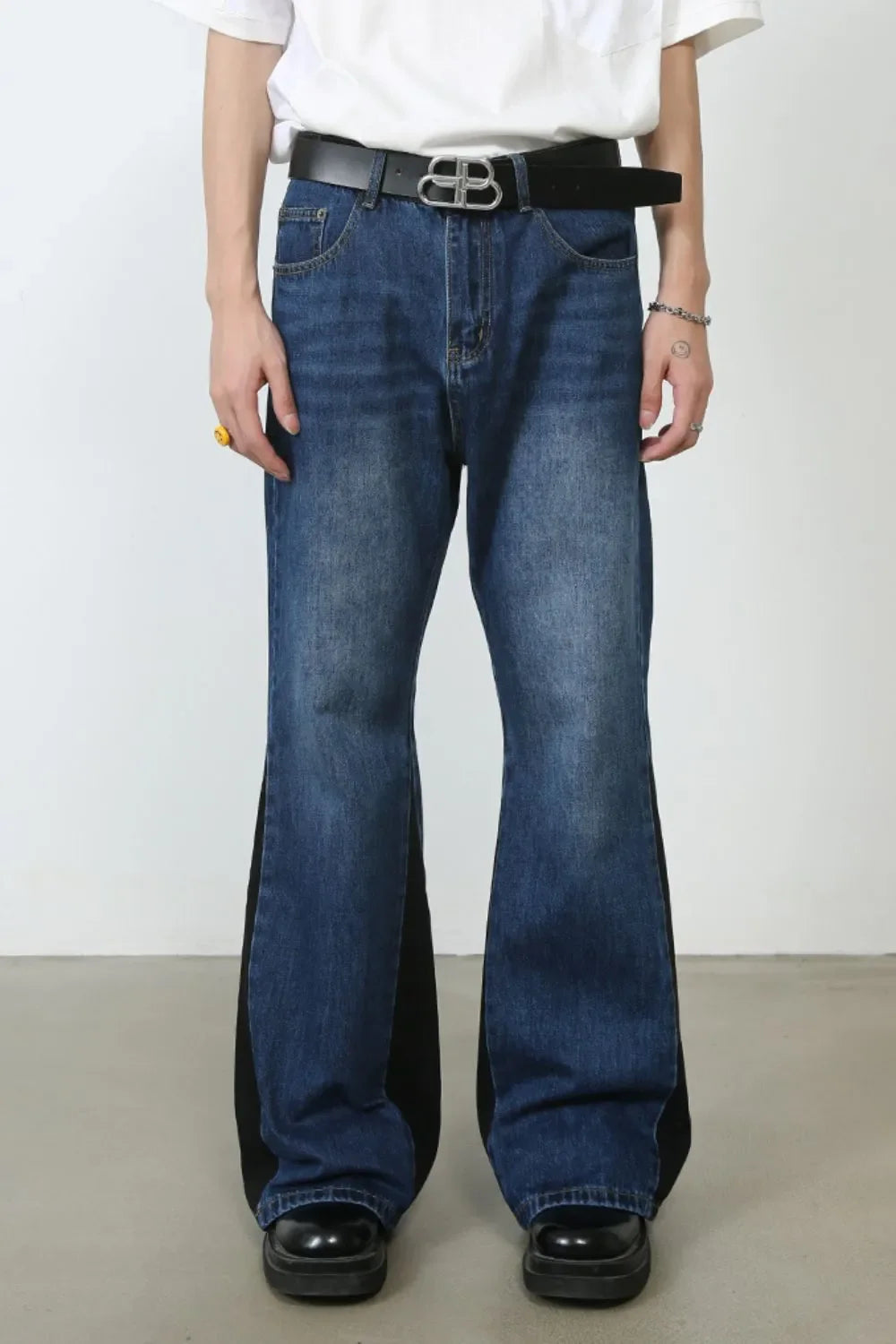 Contrast panel bootcut denim trousers in medium blue with black side panels.