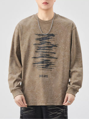 Brown oversized long-sleeve t-shirt with black graphic text and the word DREAMS.