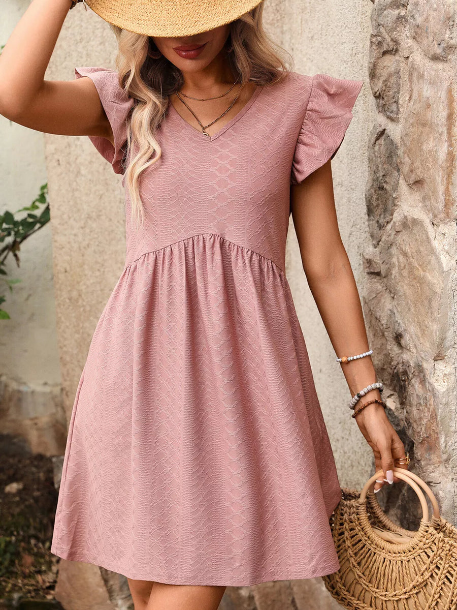 A-line dress in bean paste powder with ruffled sleeves and textured fabric.