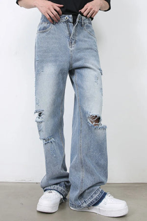 Light blue distressed wide-leg jeans with raw hem detail and ripped knees.