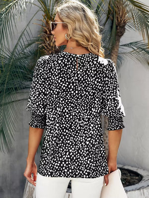 Black animal print blouse with half sleeves and ruched cuffs.