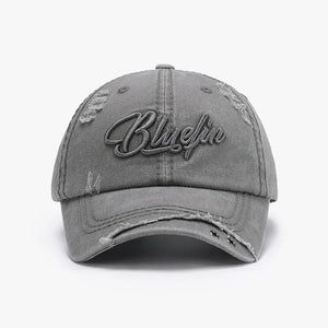 Gray cotton baseball cap with distressed details and embroidered text