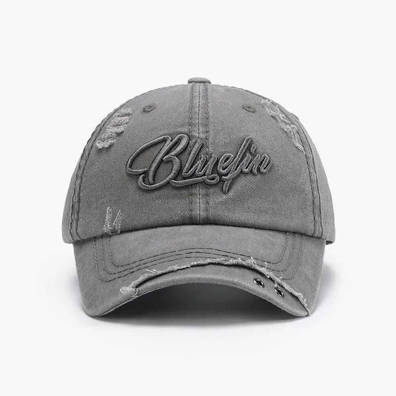 Gray cotton baseball cap with distressed details and embroidered text
