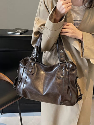 Large vintage brown PU leather shoulder bag with silver hardware details.