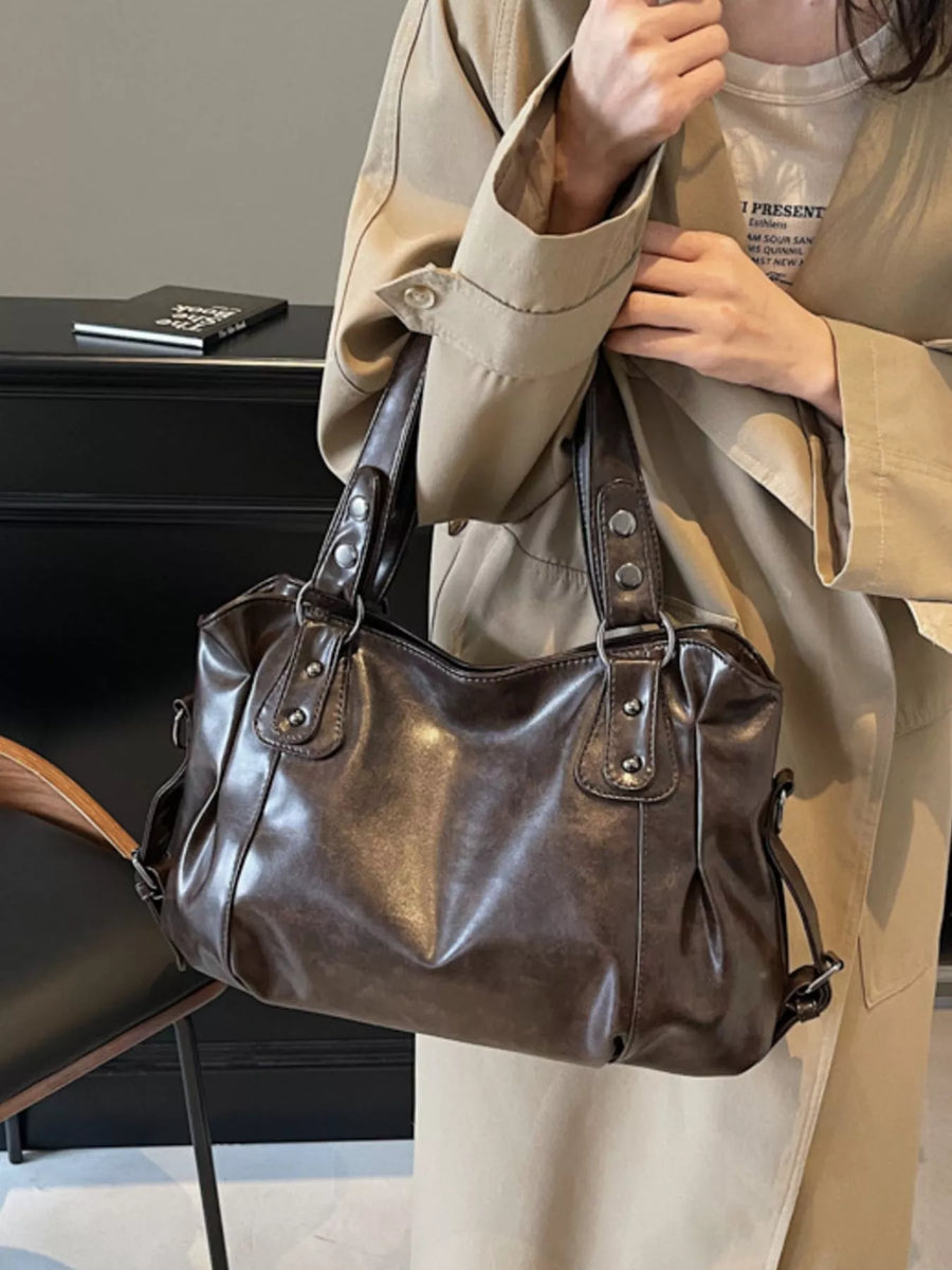 Large vintage brown PU leather shoulder bag with silver hardware details.