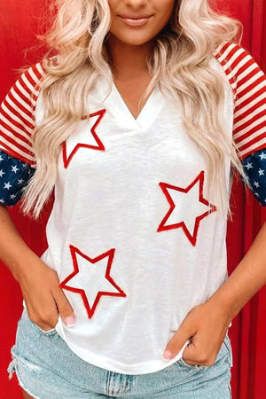 White v-neck t-shirt with red outlined stars and flag-inspired sleeves.