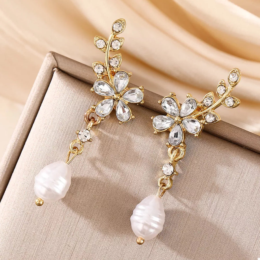 earrings in gold with floral and pearl drop