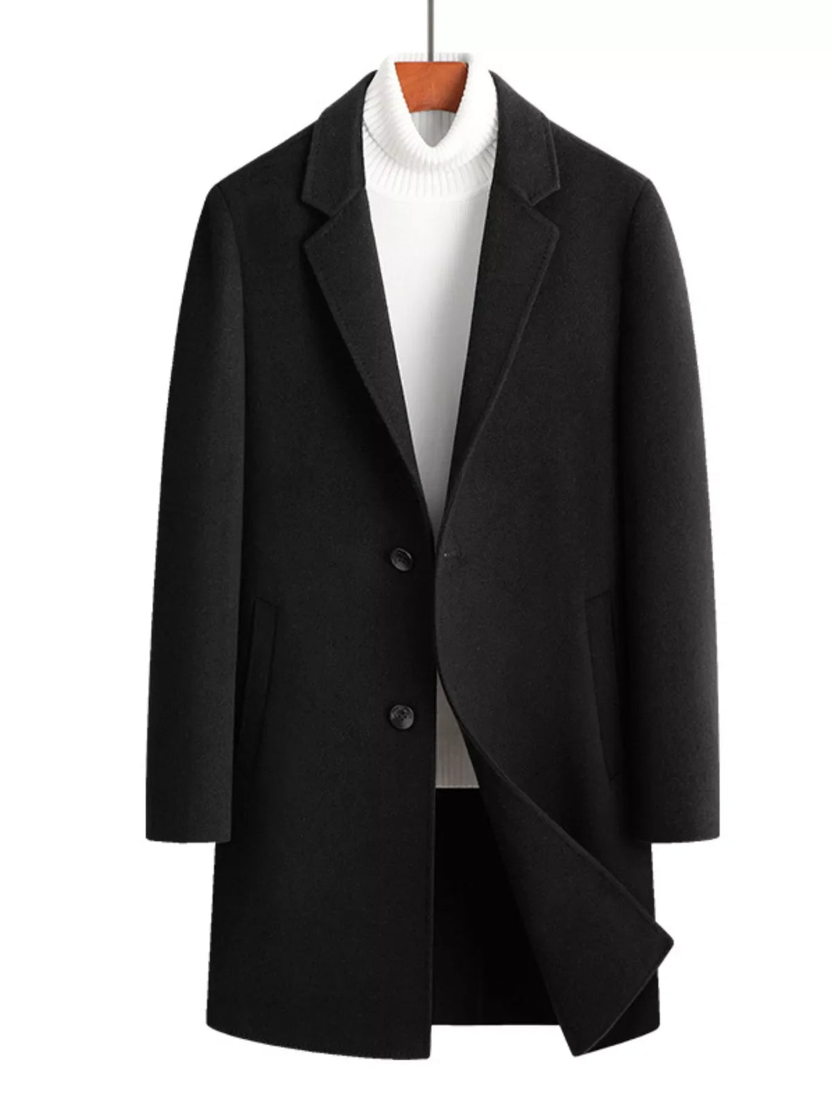 Men's black wool blend overcoat with button closure and notched lapels, styled with a white turtleneck.