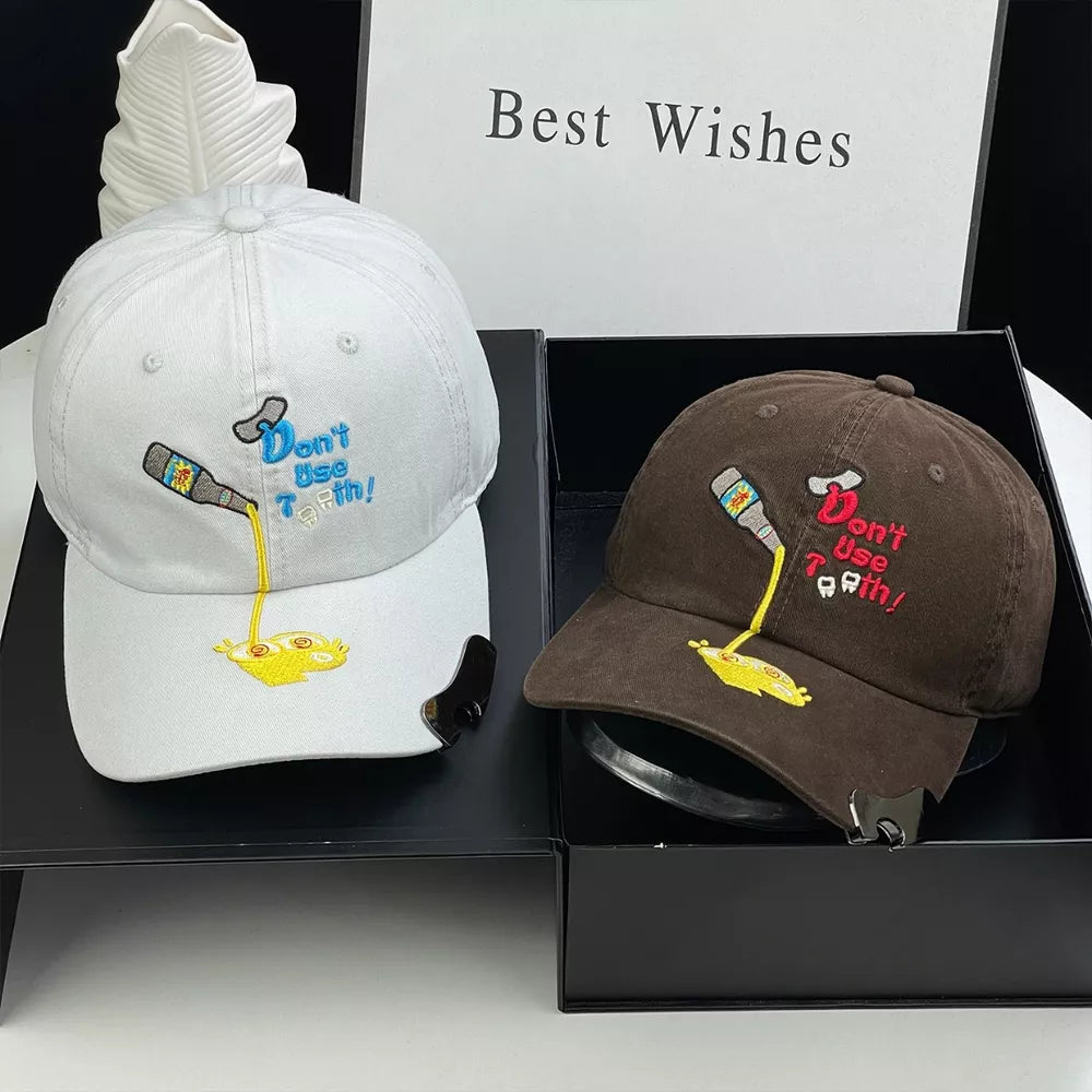 Brown and white baseball caps with embroidered cartoon bottle and text.