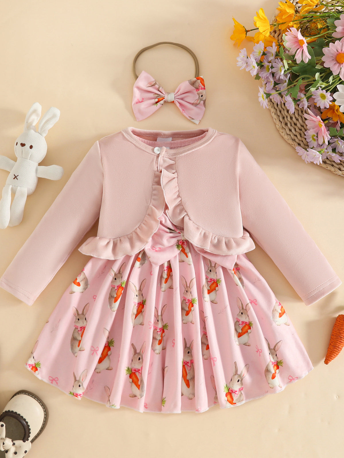 Pink baby set with ruffled cardigan and bunny carrot print dress, includes matching bow headband.