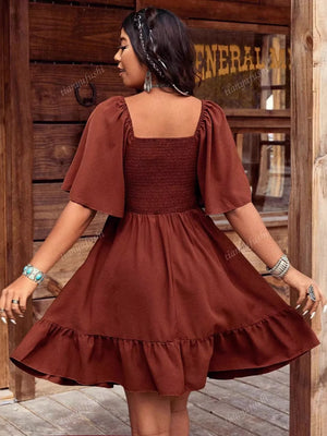 Dark brown smocked bodice flutter sleeve dress with ruffled hem