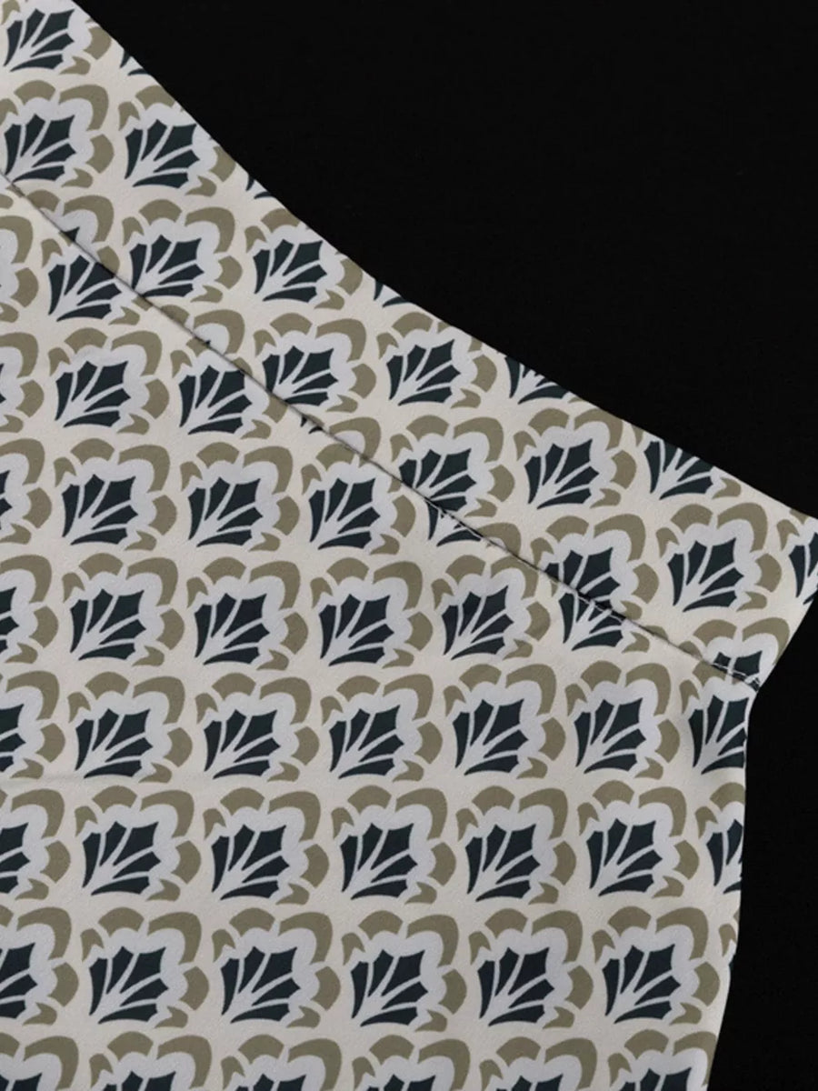 Top with cream background and repeating dark blue and tan floral pattern
