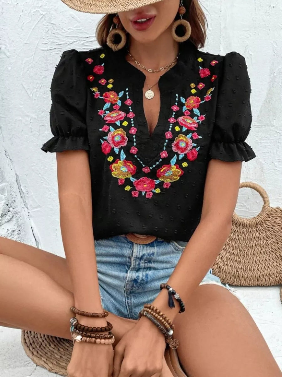 Black embroidered puff sleeve blouse with floral detail and v-neck