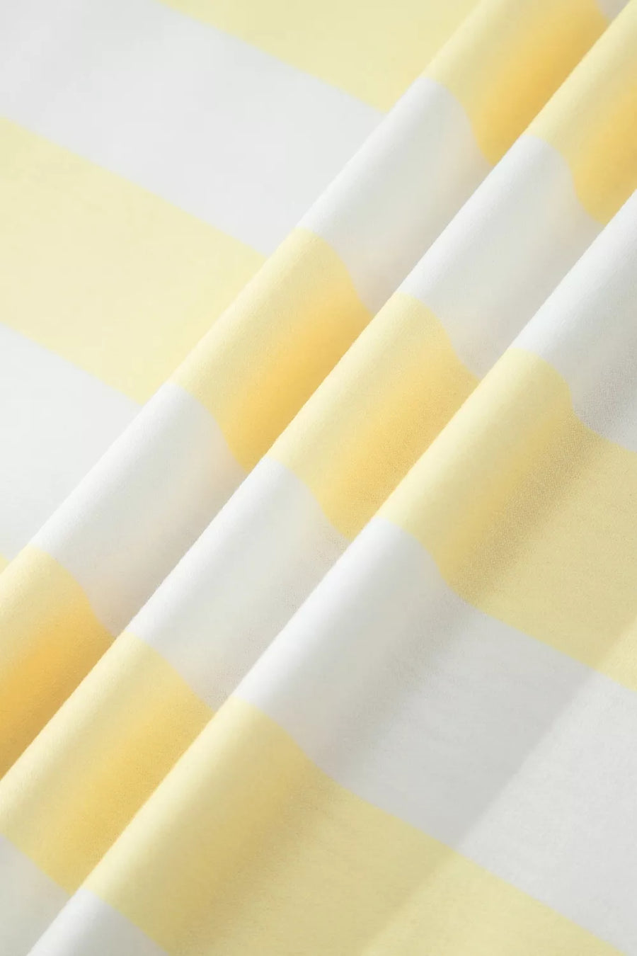 Fabric with yellow and white horizontal stripes