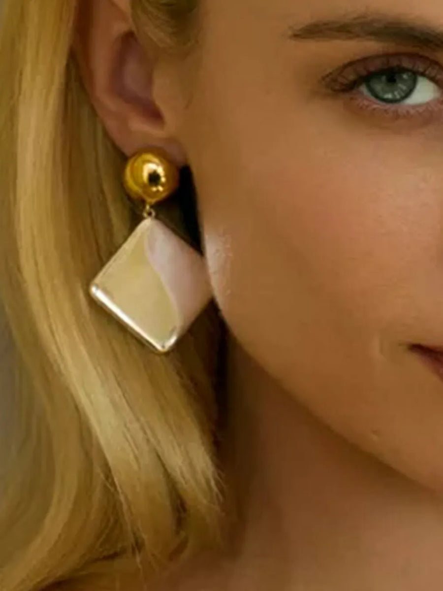 metal earrings in ivory with drop silhouette