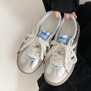 Retro suede trainers in silver with signature stripes and white laces.