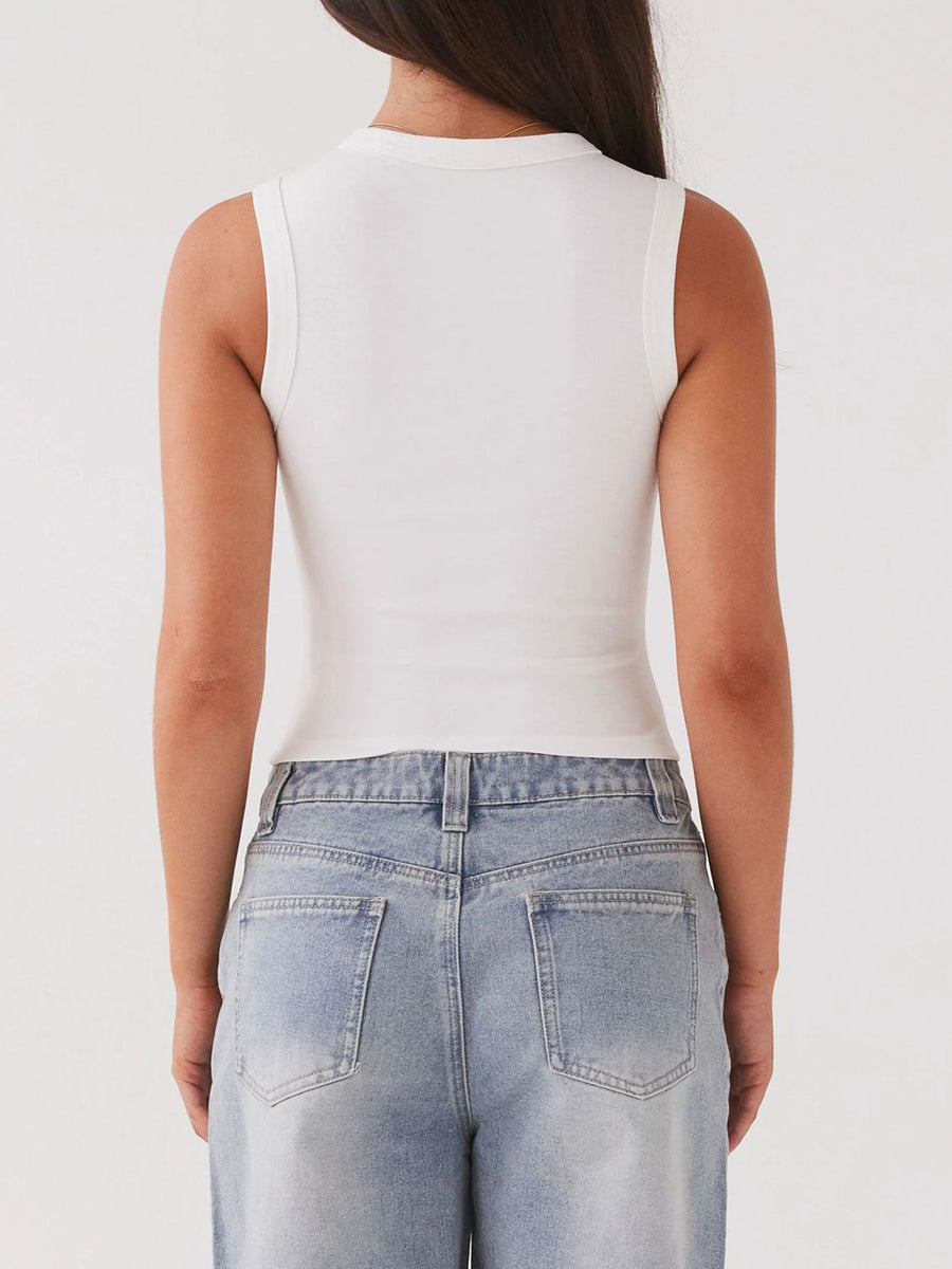 White ribbed knit button-down crop top with a high neckline.