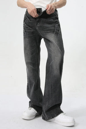 Washed black wide-leg denim jeans with a relaxed fit and subtle whiskering details.