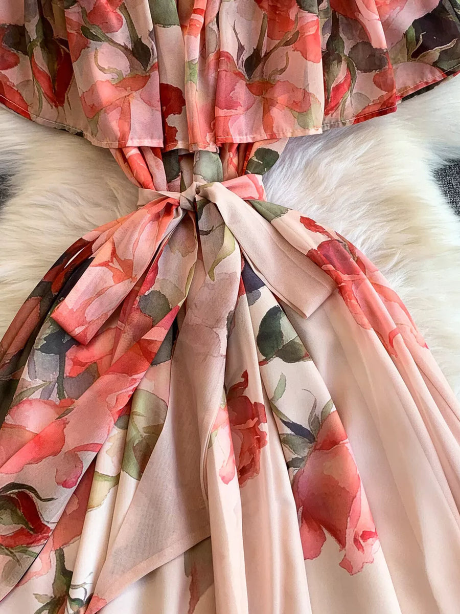 Botanical off-shoulder dress in light pink with floral print and belted waist detail.