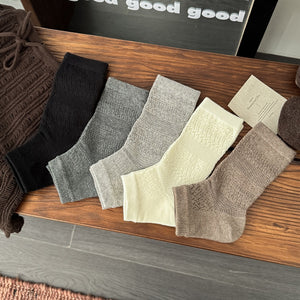 socks in black featuring textured knit and fitted fit