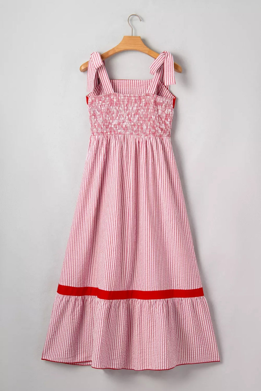 Red and white striped cotton maxi dress with smocked bodice and tie straps.