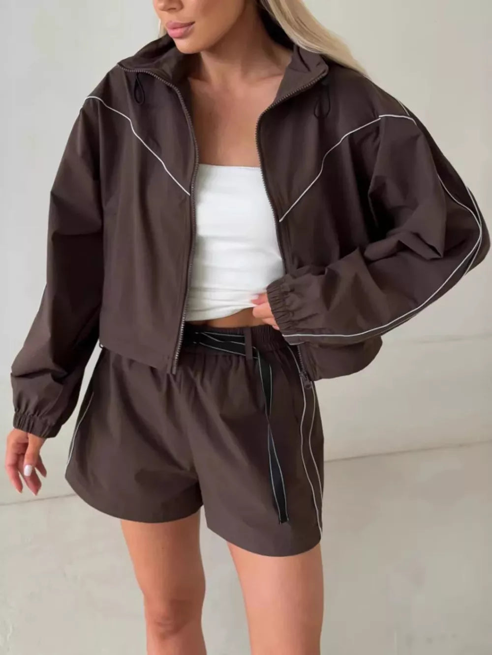 100% polyester Care instructions: Machine wash cold track jacket in Brown with relaxed silhouette