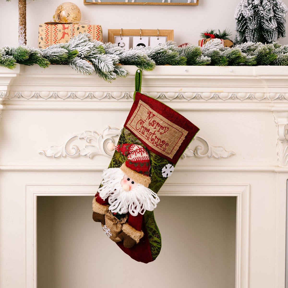 Embroidered Christmas stocking with Santa figure and Merry Christmas text, green and red.