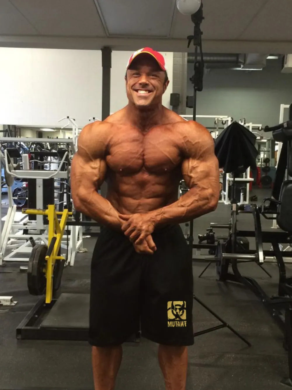 Black gym shorts with yellow Mutant logo detail