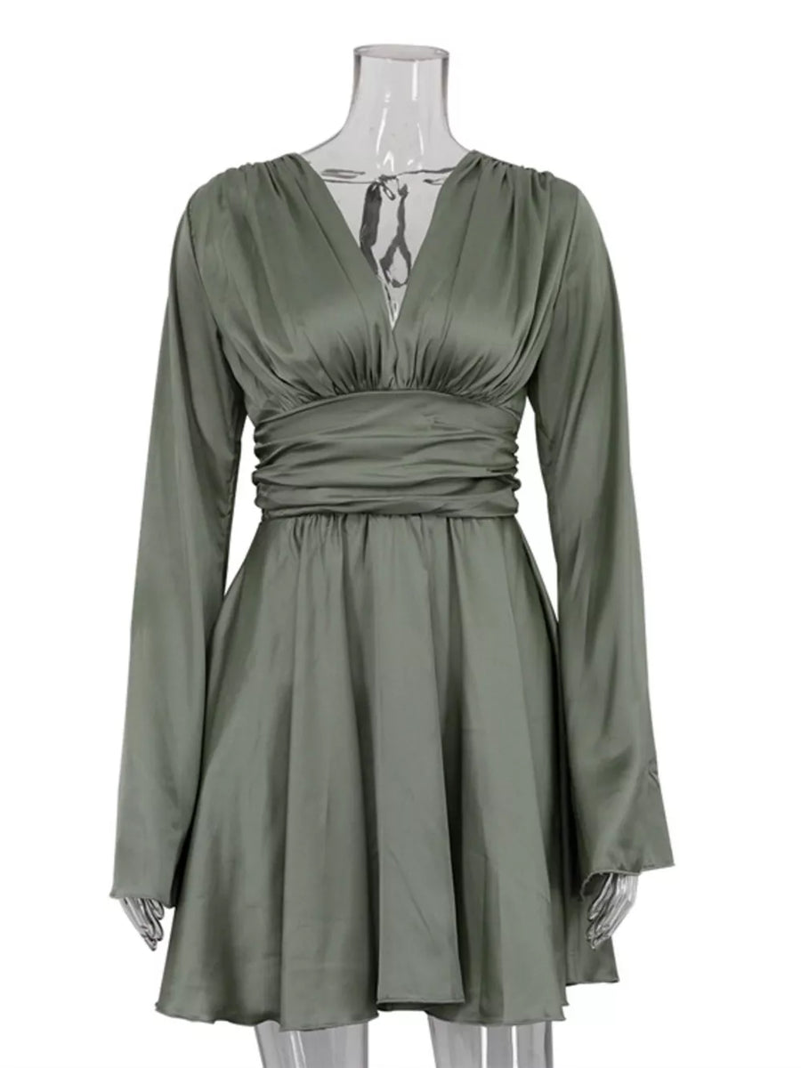Sage green satin dress with V-neck, long sleeves, and cinched waist.