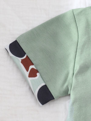 Sage baby polo shirt with camouflage print cuff detail