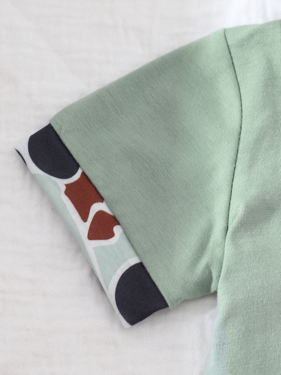Sage baby polo shirt with camouflage print cuff detail
