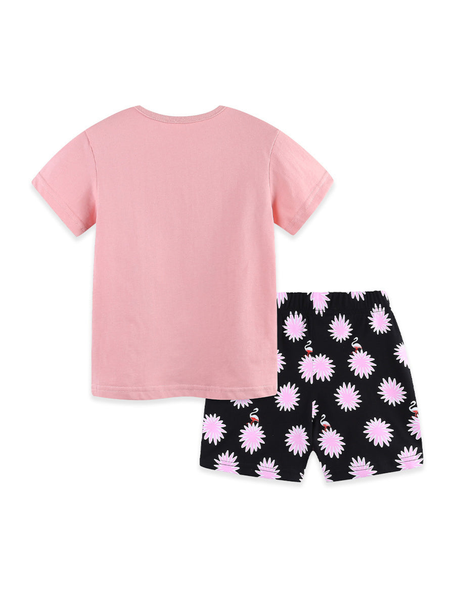 Pink cotton t-shirt with black shorts featuring a flamingo and floral print.
