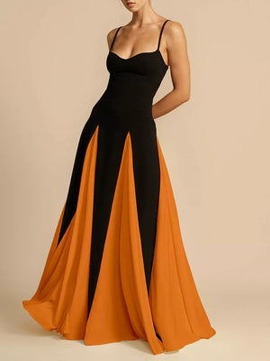 Elegant black maxi dress with spaghetti straps and orange colorblock skirt panels.
