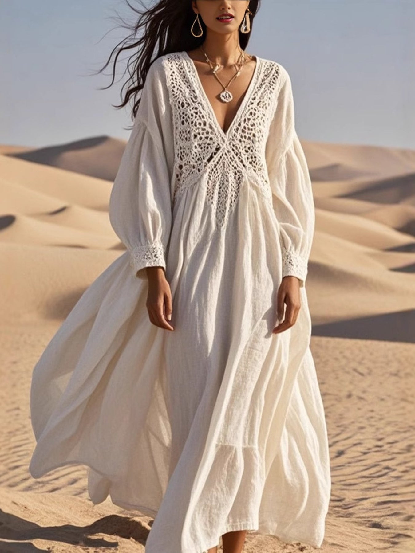 White crochet lace V-neck midi dress with long sleeves and cutout details.