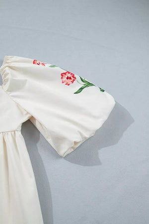 Floral puff sleeve dress in cream with pink floral embroidery and gathered waist