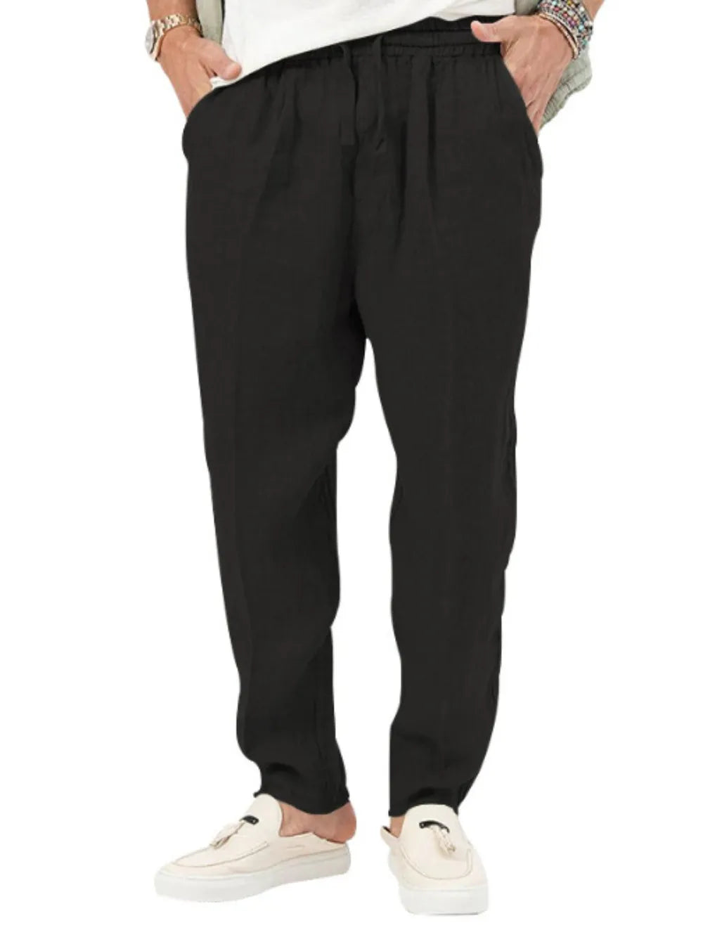 Black linen drawstring trousers with relaxed fit and adjustable waist.