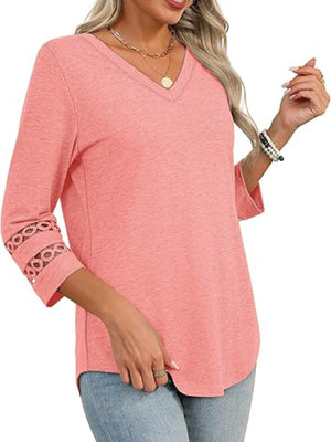 Pink 3/4 sleeve t-shirt with V-neck and cutout detail on sleeves.