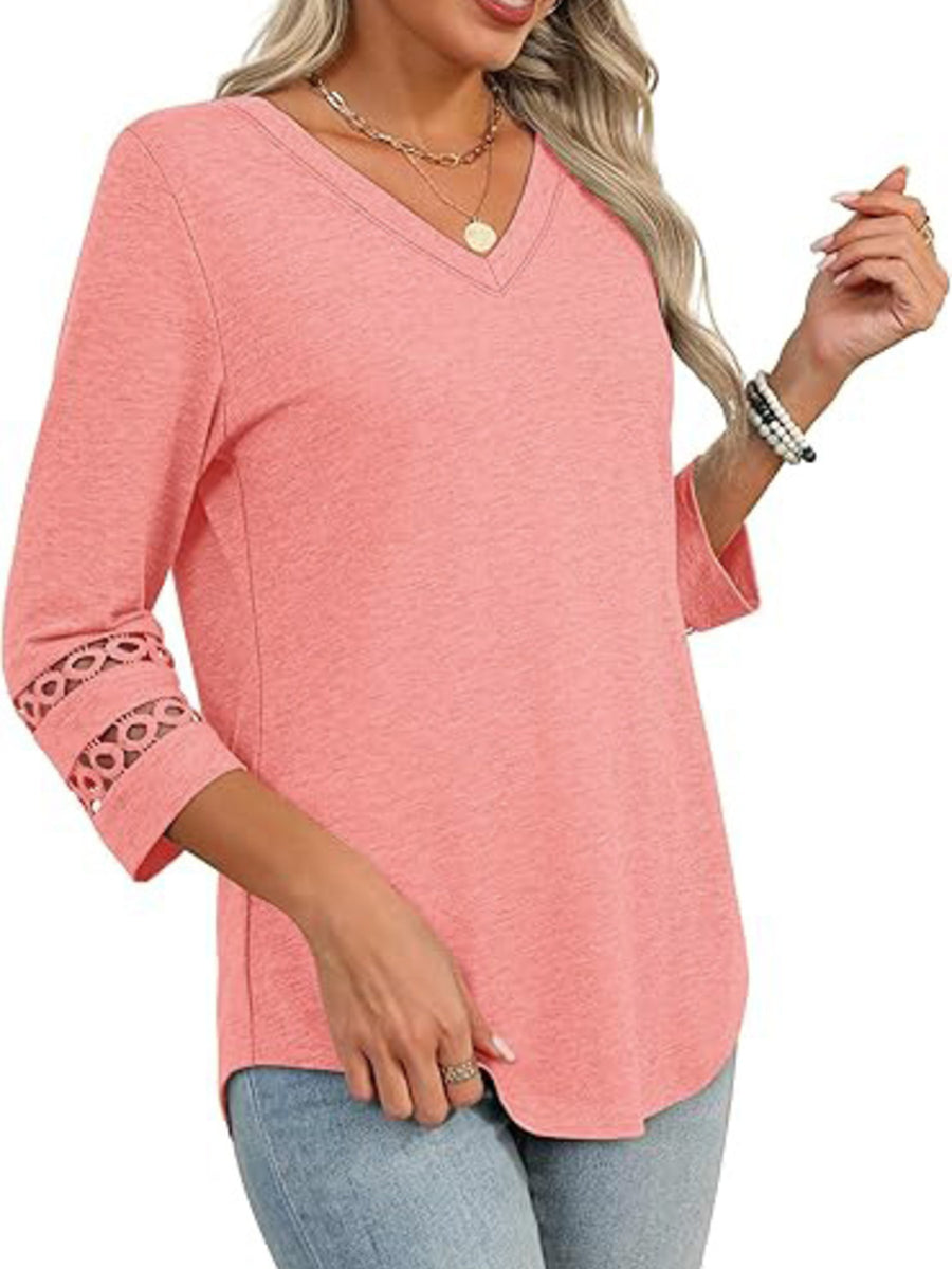 Pink 3/4 sleeve t-shirt with V-neck and cutout detail on sleeves.