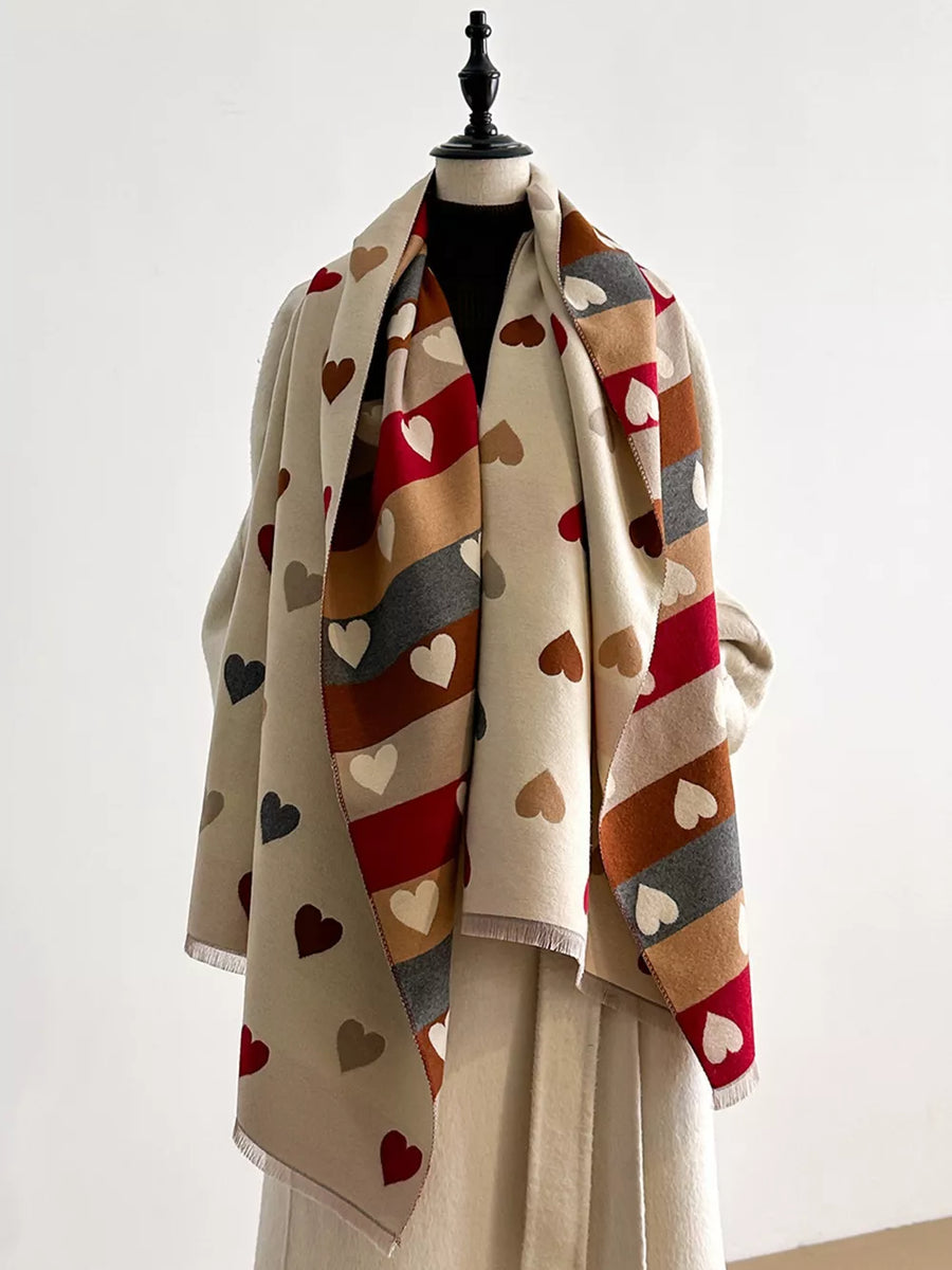 Cozy scarf with all-over heart print in beige, brown, gray, and red stripes.