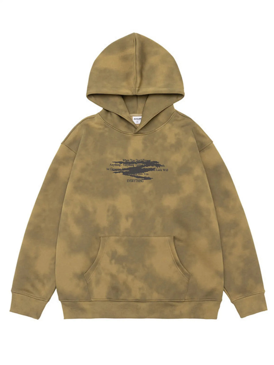 Oversized tie-dye hoodie in Wilderness Wood Green with graphic text and front pocket.