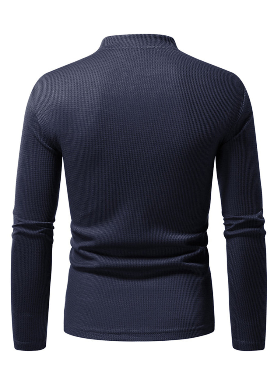 Men's navy blue long sleeve waffle knit undershirt with a mock neck.