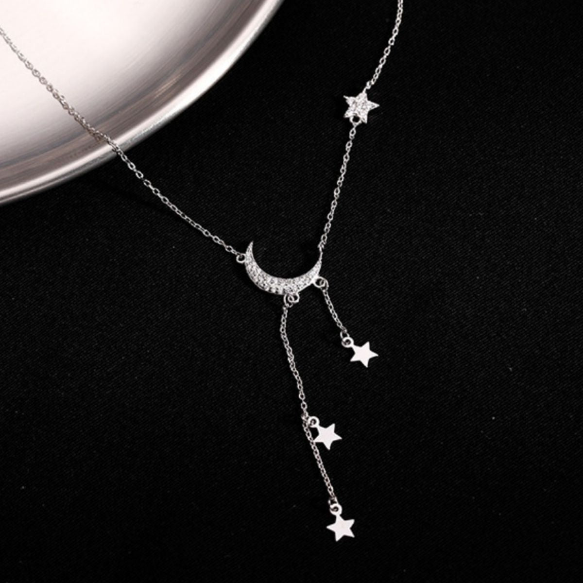 clear necklace featuring zircon embellishment and celestial