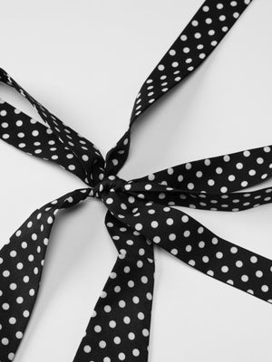 Black polka dot halter neck maxi dress tie detail
