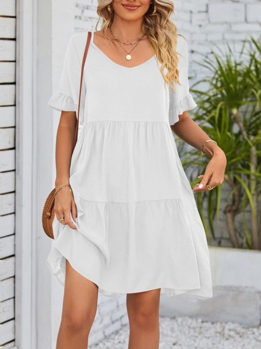 White ruffled sleeve mini dress with tiered skirt and V-neck.